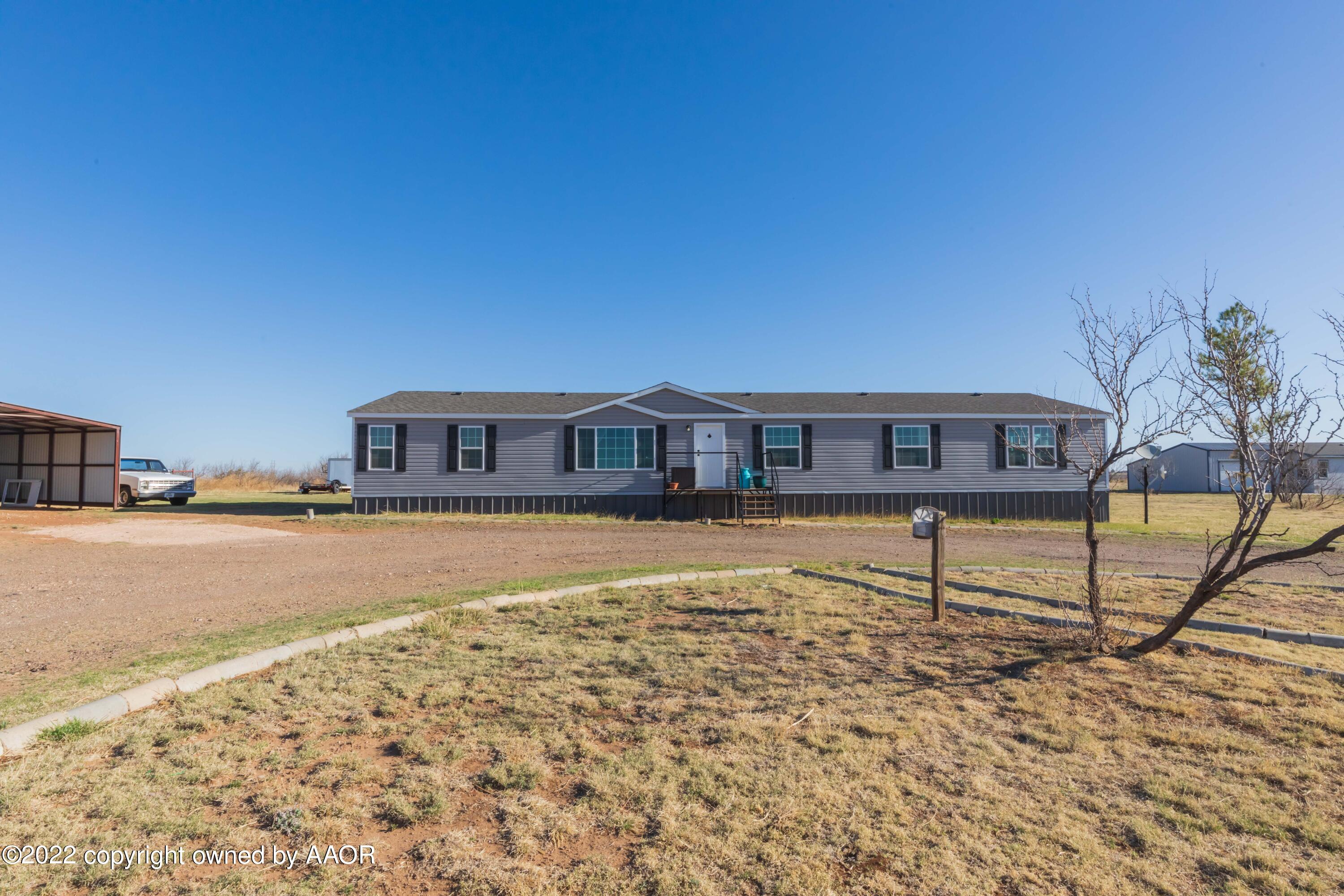 a front view of a house with swimming pool