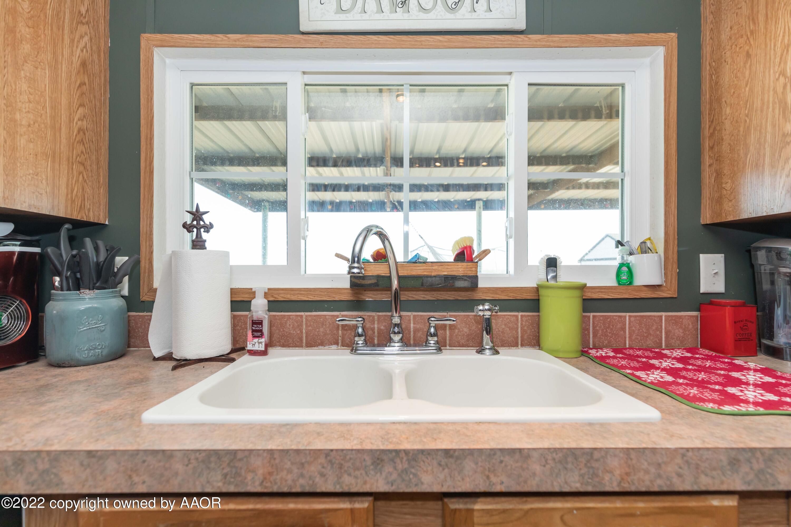 5600 Tomahawk Trail Amarillo, TX 79124 - Photo 13 of 36 a room with a sink and a mirror