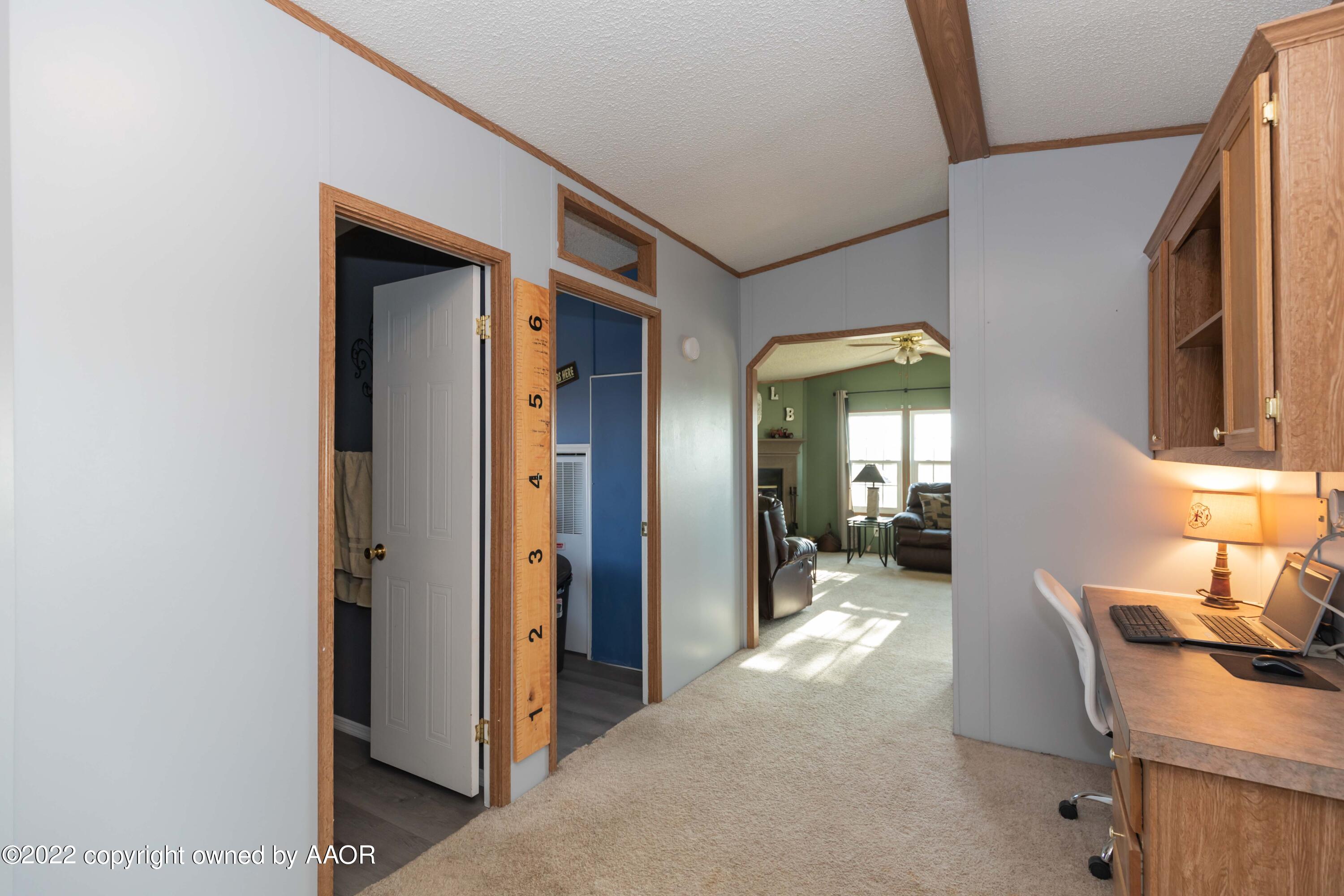 5600 Tomahawk Trail Amarillo, TX 79124 - Photo 17 of 36 a view of a hallway to a livingroom with furniture