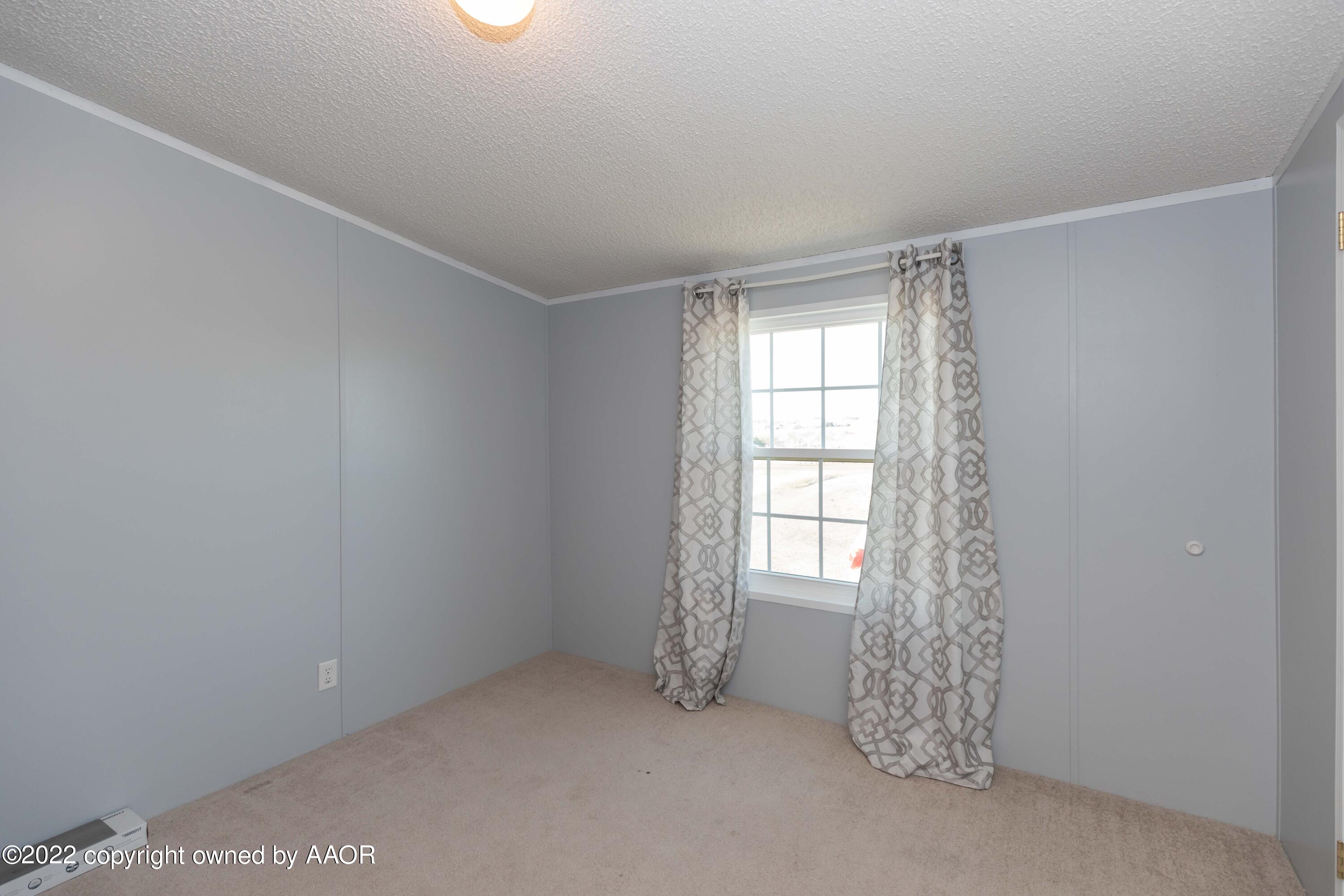 5600 Tomahawk Trail Amarillo, TX 79124 - Photo 24 of 36 a view of an empty room with a window
