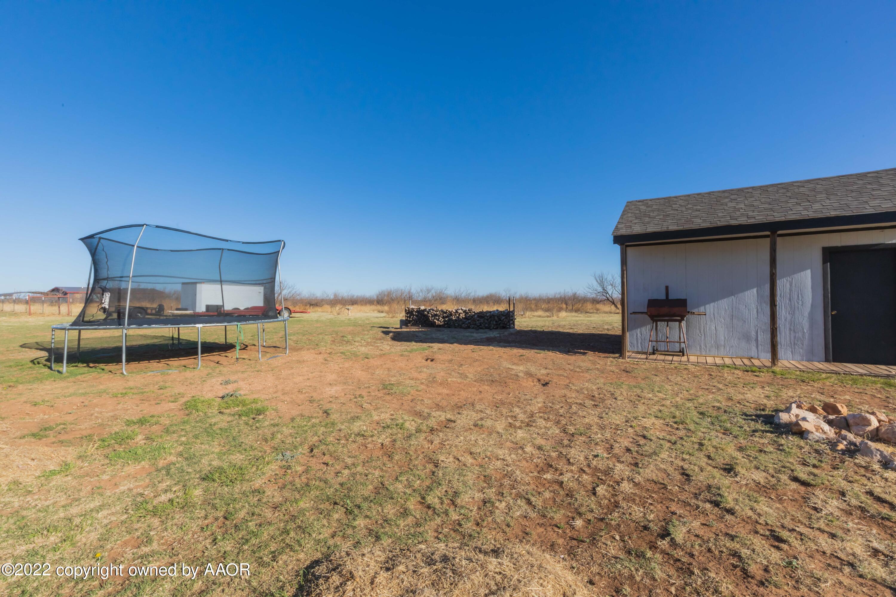5600 Tomahawk Trail Amarillo, TX 79124 - Photo 36 of 36 a backyard of a house with table and chairs