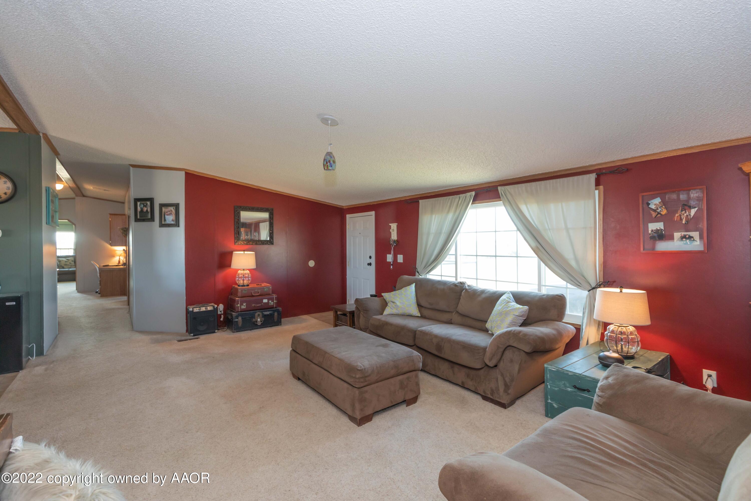 5600 Tomahawk Trail Amarillo, TX 79124 - Photo 8 of 36 a living room with furniture and a large window