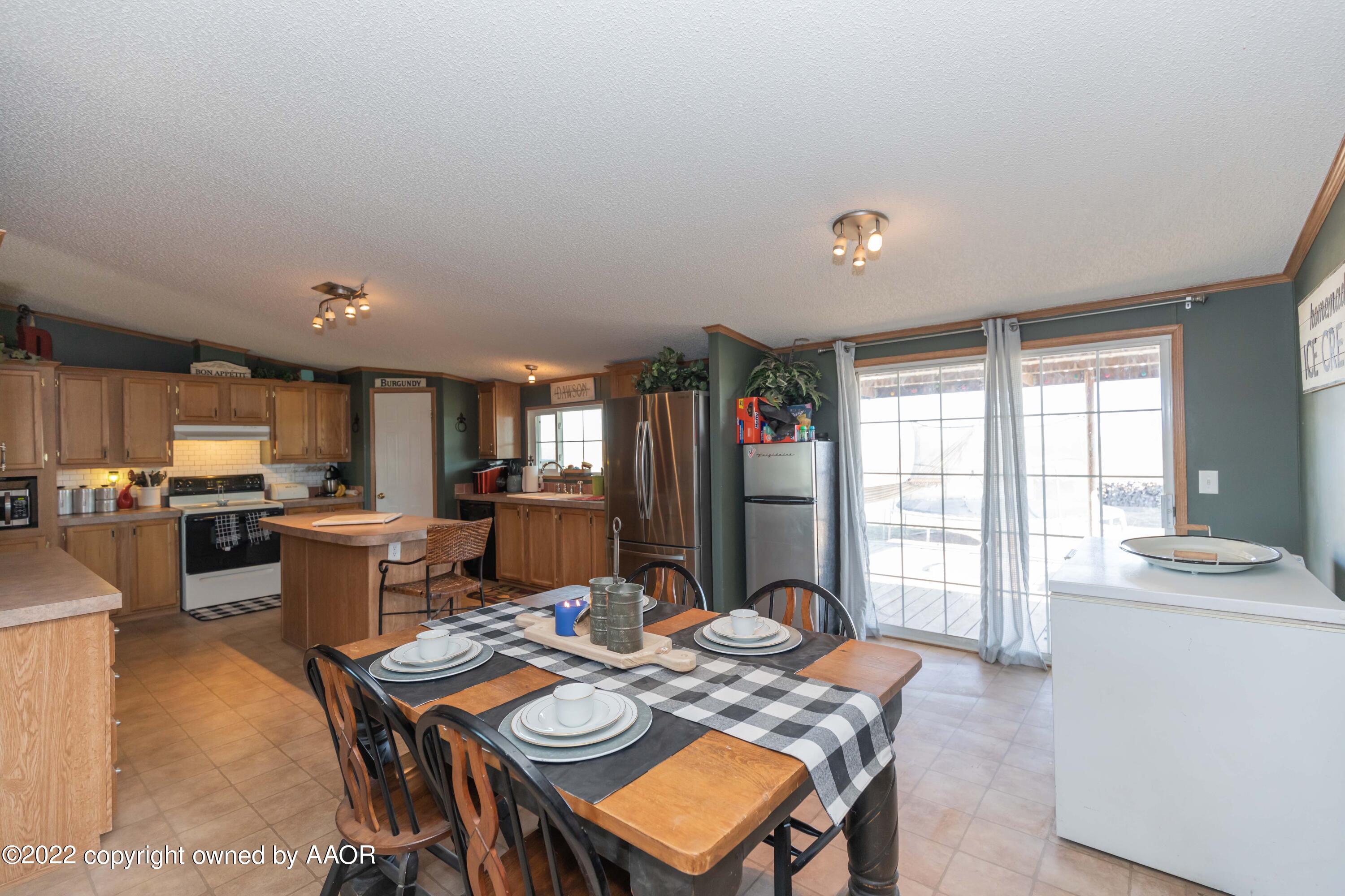 5600 Tomahawk Trail Amarillo, TX 79124 - Photo 9 of 36 a kitchen with a table and chairs in it