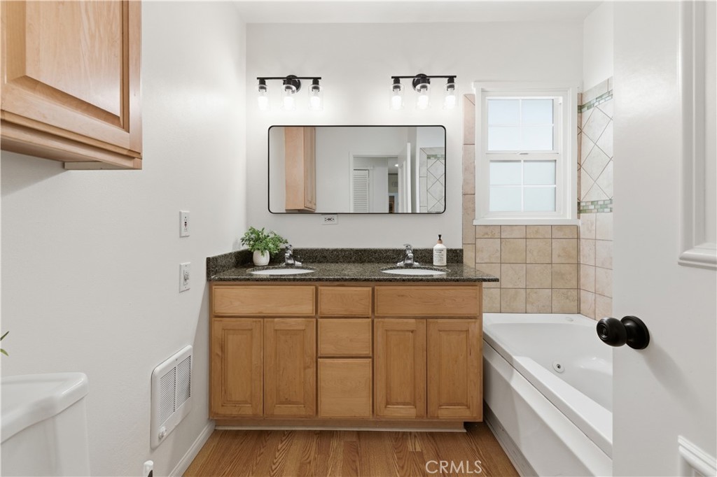 3327 North Studebaker Road Long Beach, CA 90808 - Photo 16 of 31 The main bathroom with double sinks, and lots of storage