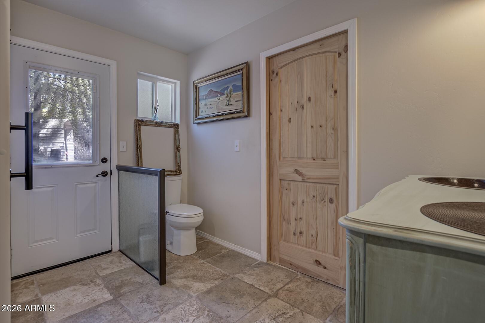 3762 Watertank Road Pine, AZ 85544 - Photo 22 of 38 a bathroom with a granite countertop sink toilet and shower