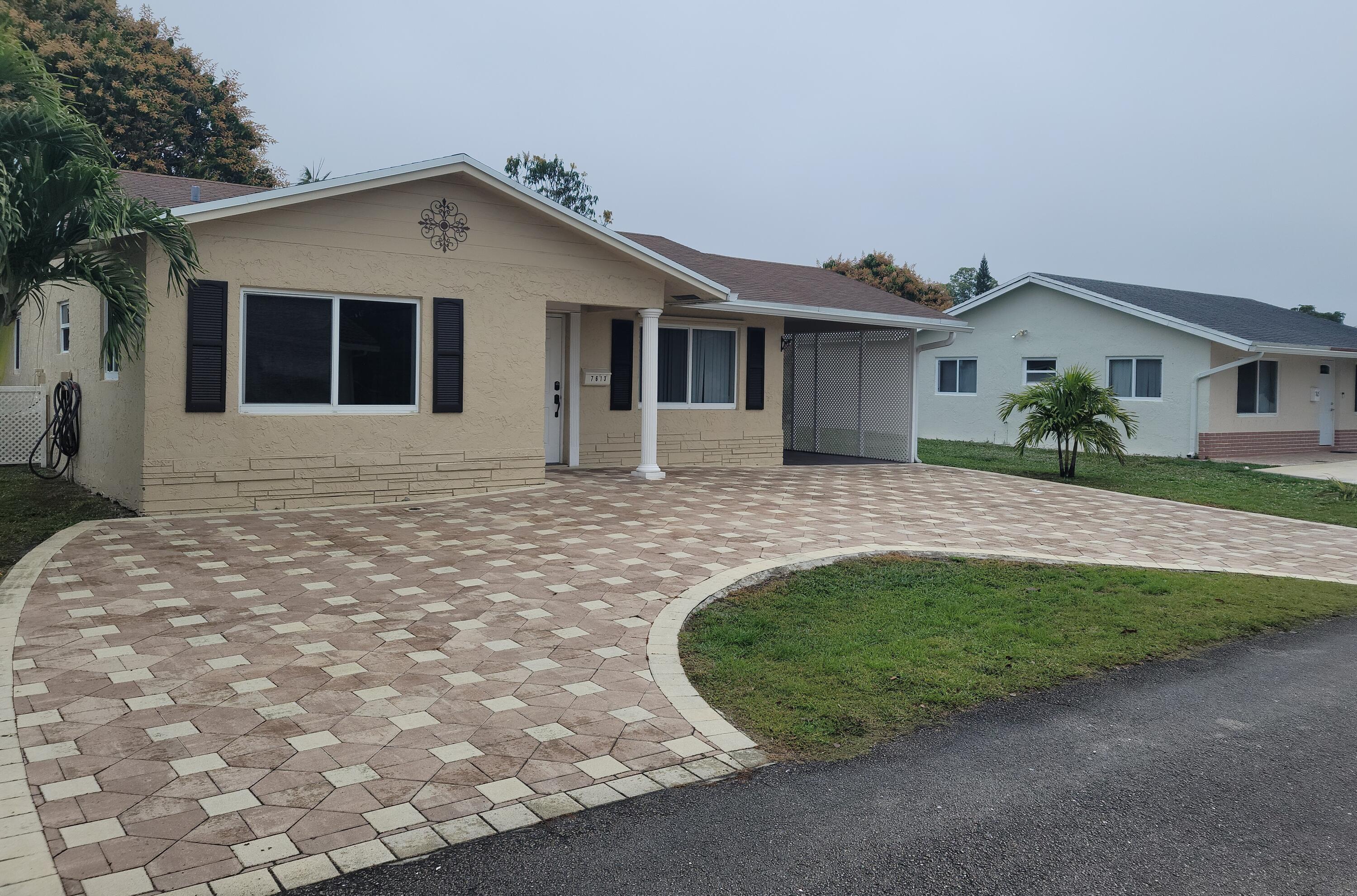 7613 Northwest 68th Terrace Tamarac, FL 33321 - Photo 1 of 13 Front Of House