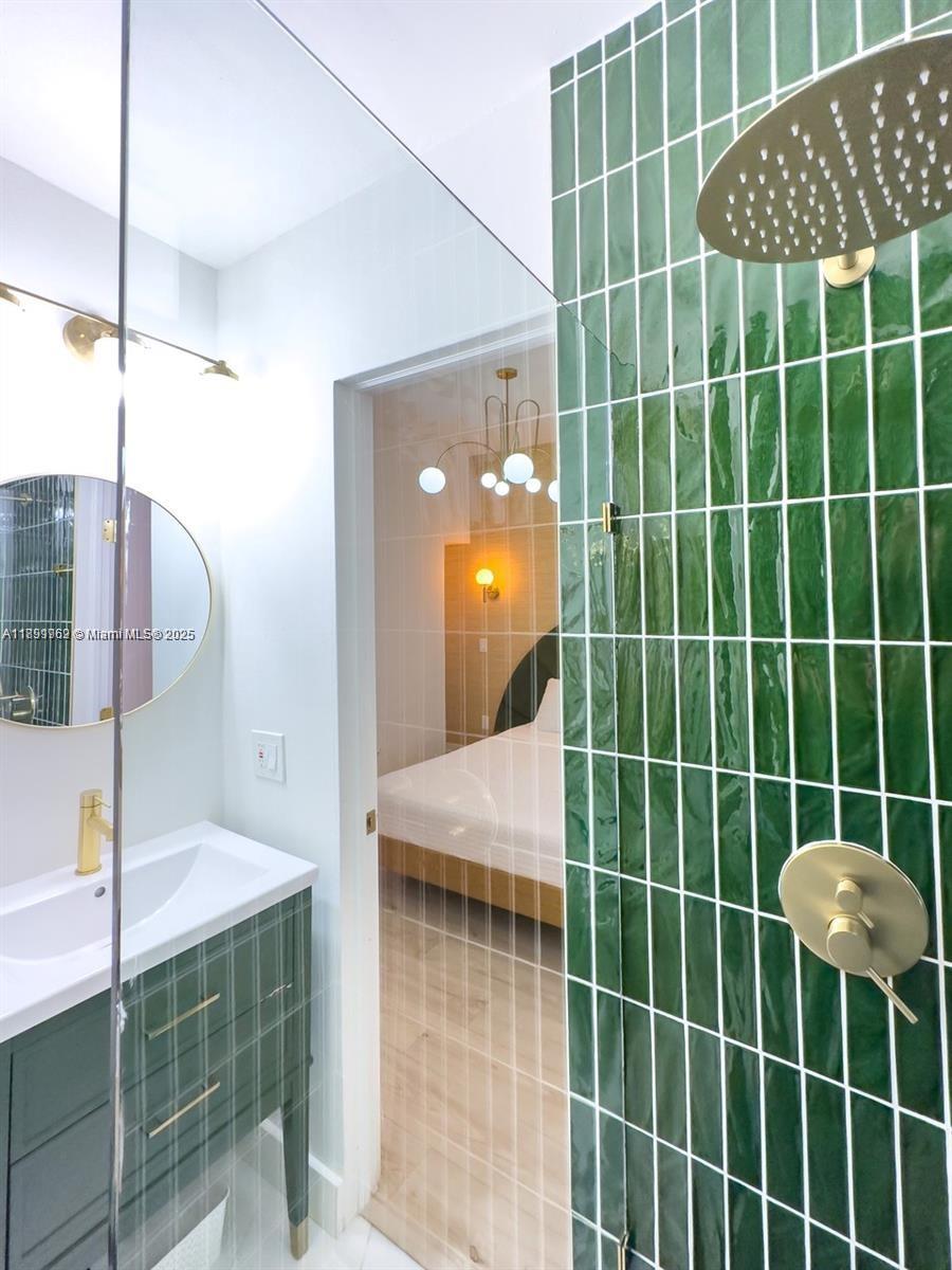 3030 Collins Avenue, Unit 1E Miami Beach, FL 33140 - Photo 11 of 15 a bathroom with a shower