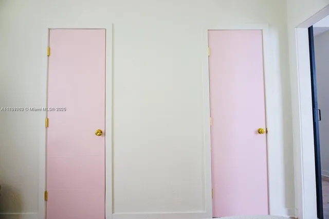 a bathroom with a toilet and shower