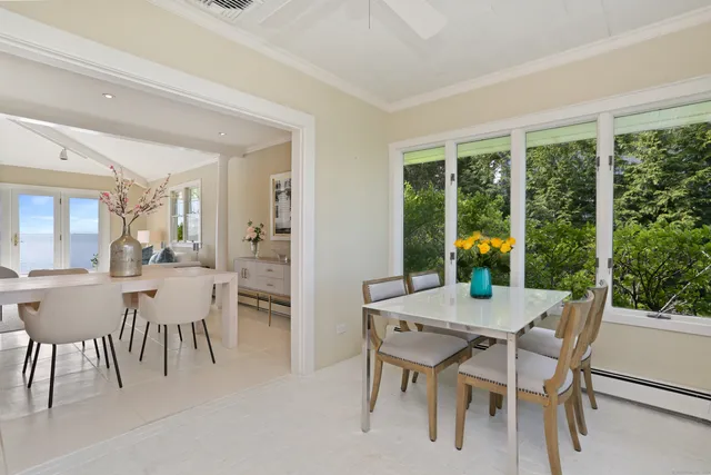 a view of a dining room with furniture and window