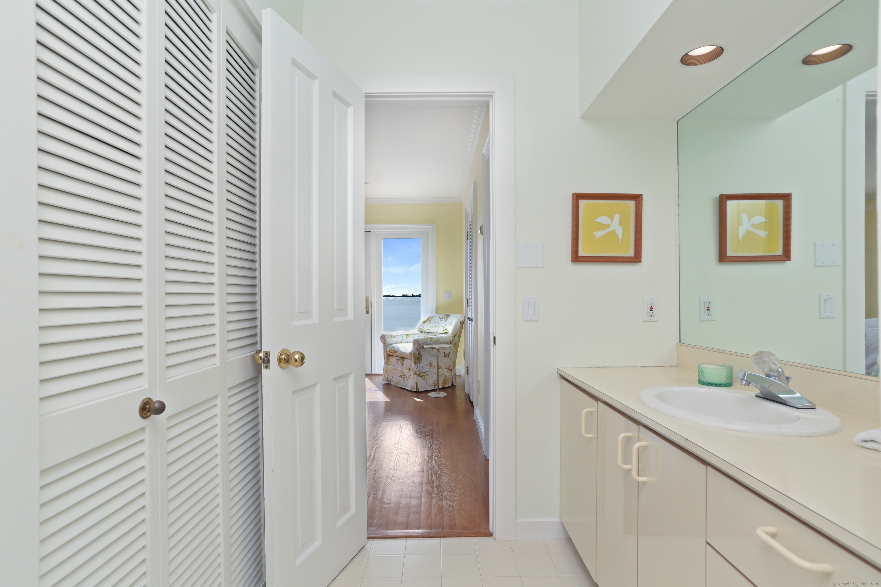 34 Shorehaven Road Norwalk, CT 06855 - Photo 18 of 40 a en suite bathroom with a sink and mirror