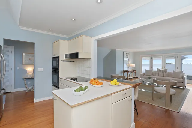 a kitchen that has a table and chairs