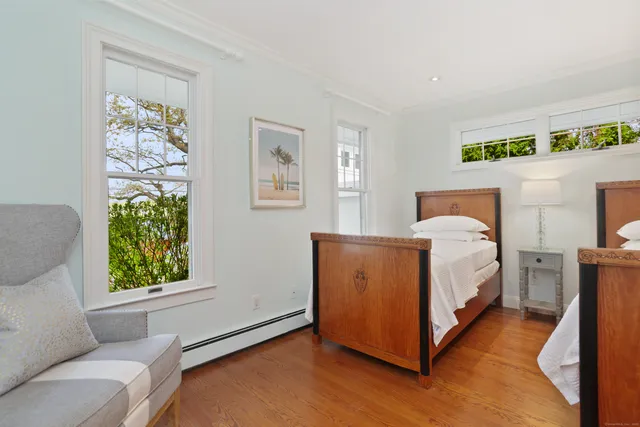 a bed room with a bed and a window