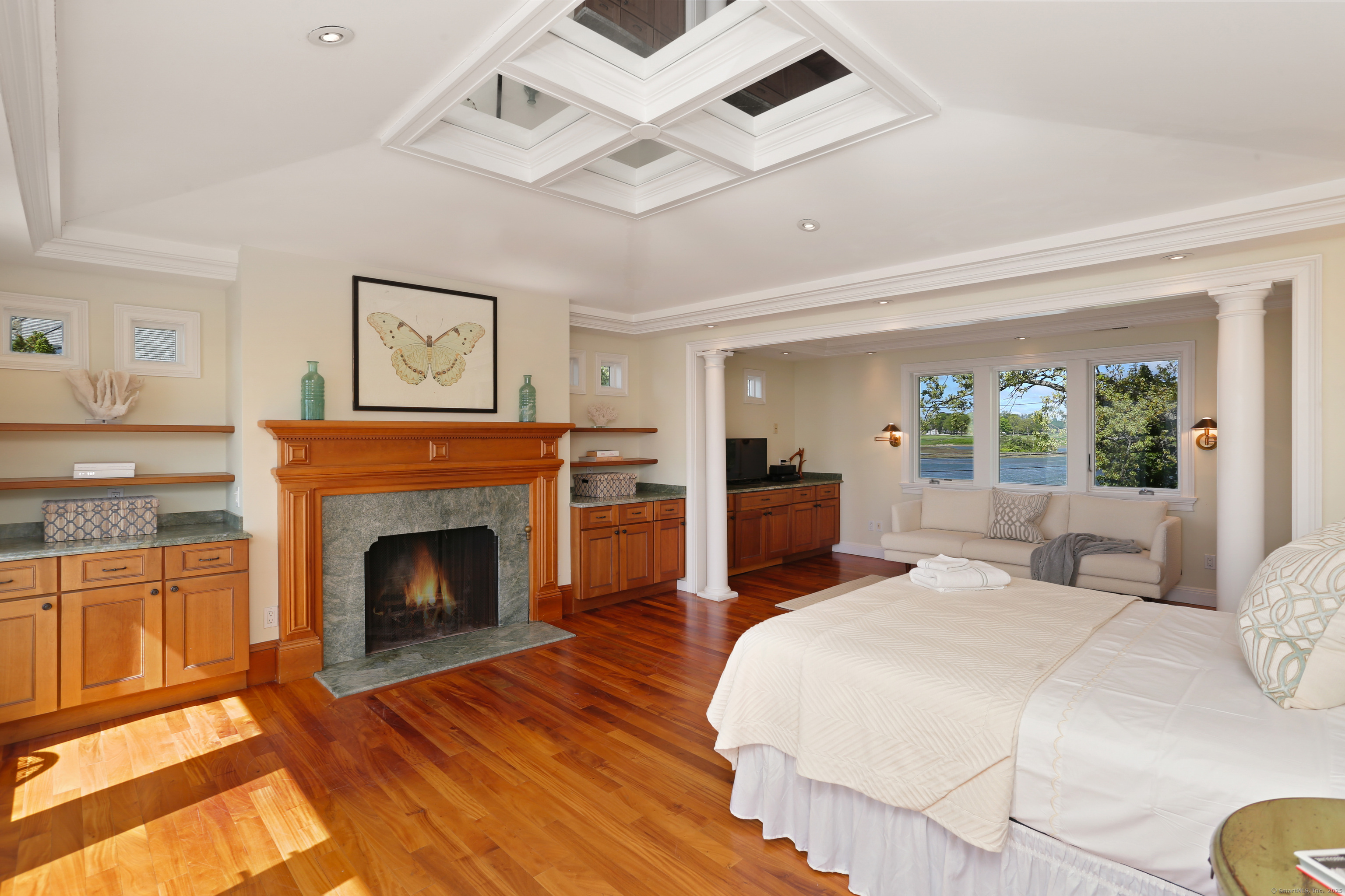 34 Shorehaven Road Norwalk, CT 06855 - Photo 23 of 40 a bed room with a bed and a fireplace