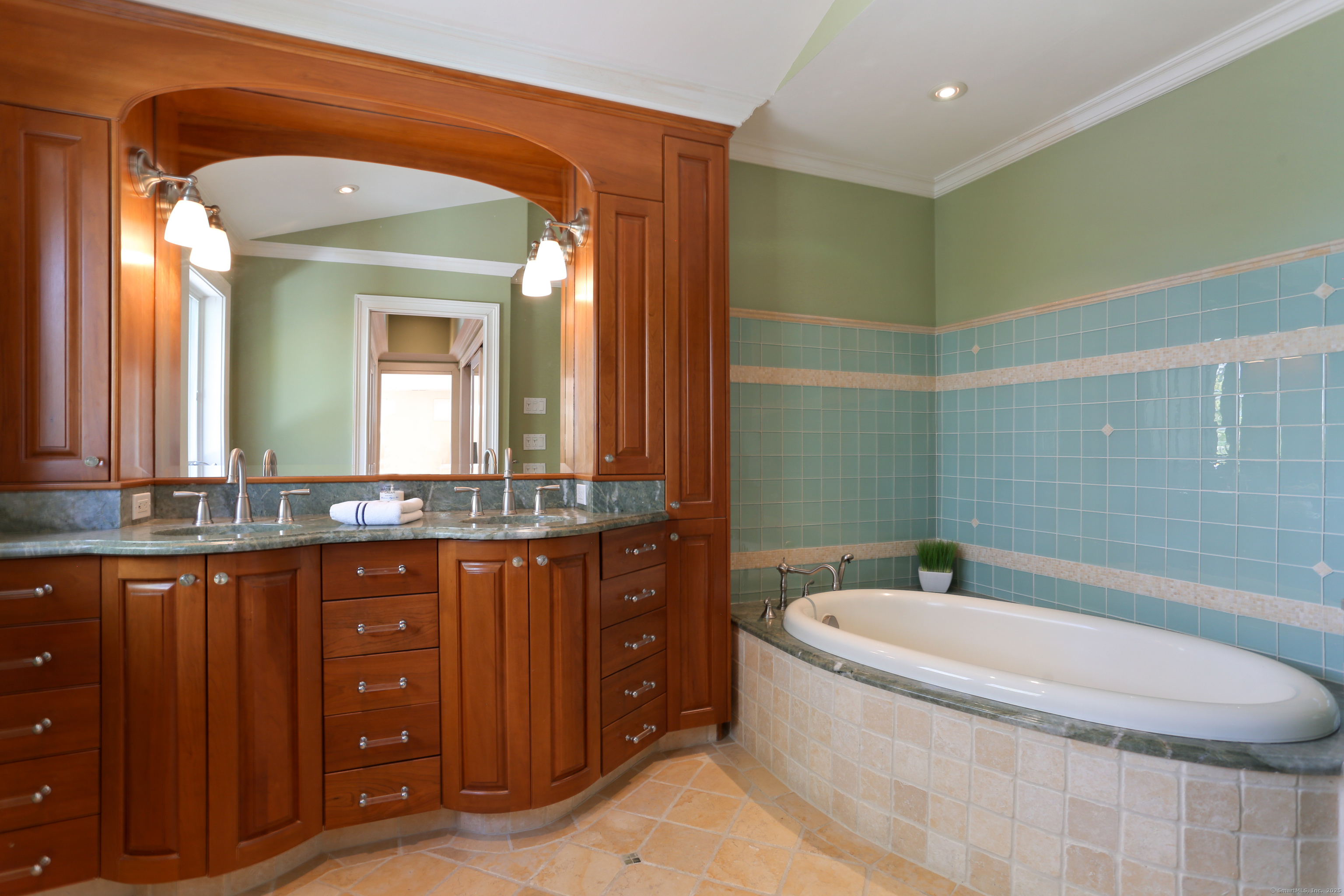 34 Shorehaven Road Norwalk, CT 06855 - Photo 27 of 40 a bathroom with a granite countertop sink and a large mirror