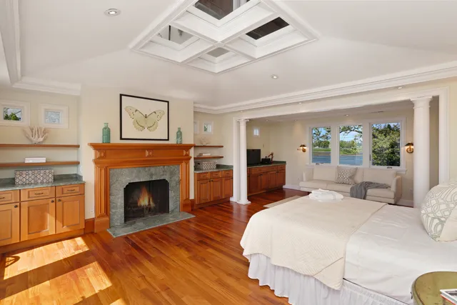 a bed room with a bed and a fireplace