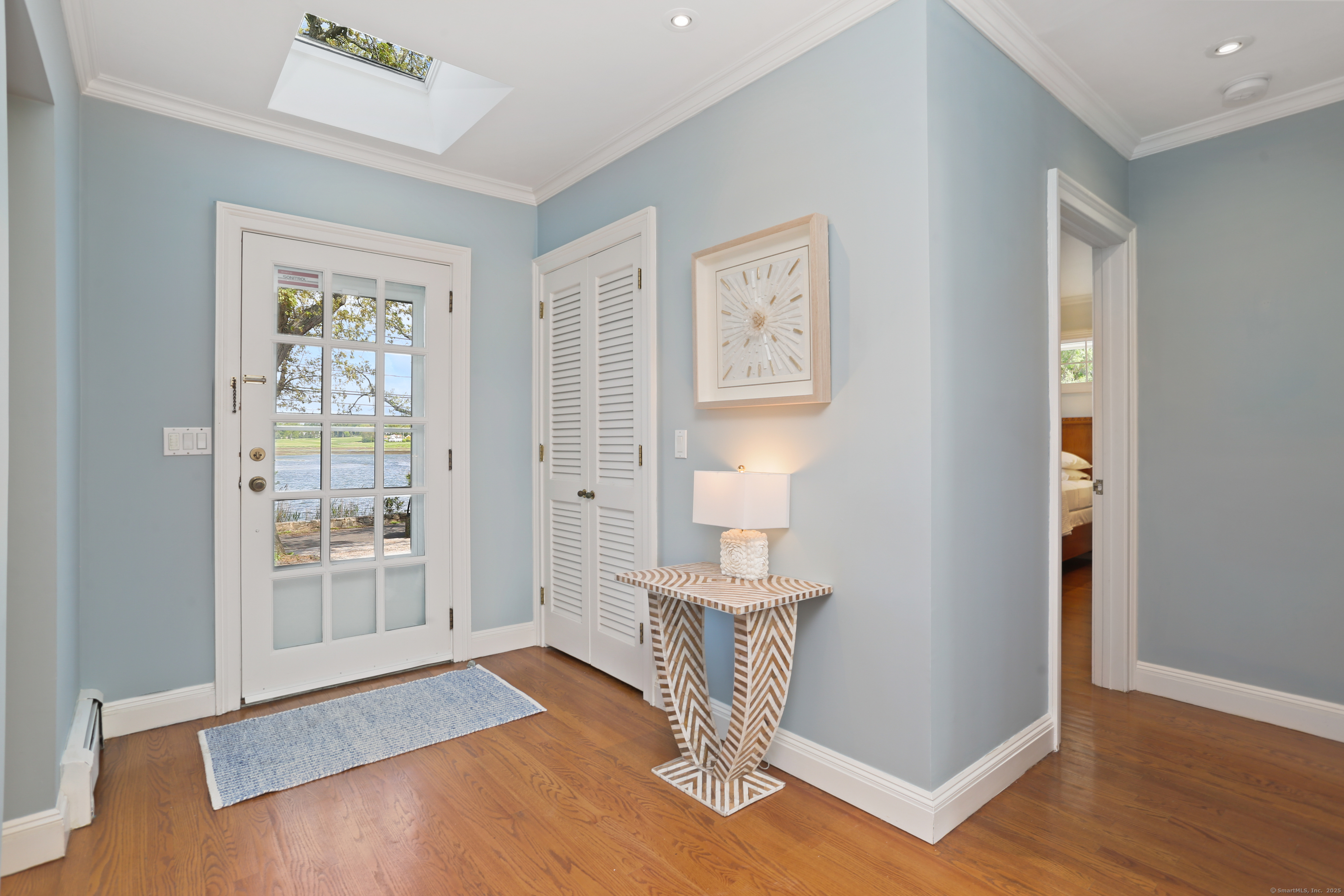34 Shorehaven Road Norwalk, CT 06855 - Photo 4 of 40 a view of an empty room with wooden floor and a window
