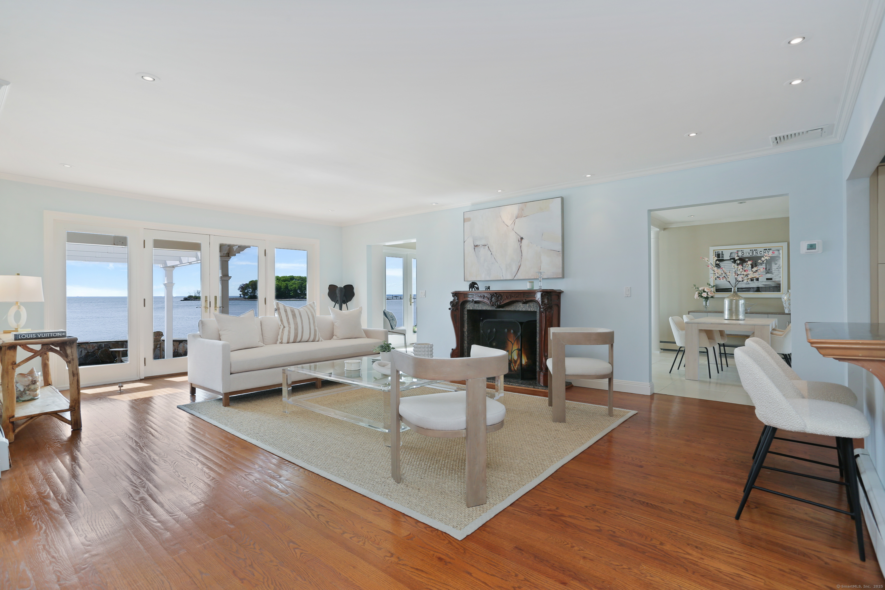 34 Shorehaven Road Norwalk, CT 06855 - Photo 5 of 40 a living room with fireplace furniture and a wooden floor