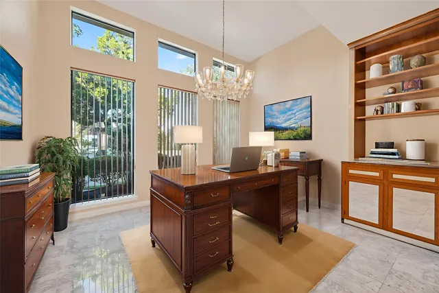 a view of a chandelier in big room and chandelier