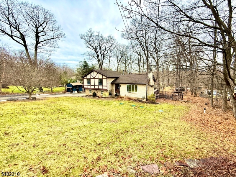 117 Papscoe Road West Milford, NJ 07421 - Photo 1 of 29 a view of a swimming pool with an outdoor space and seating area