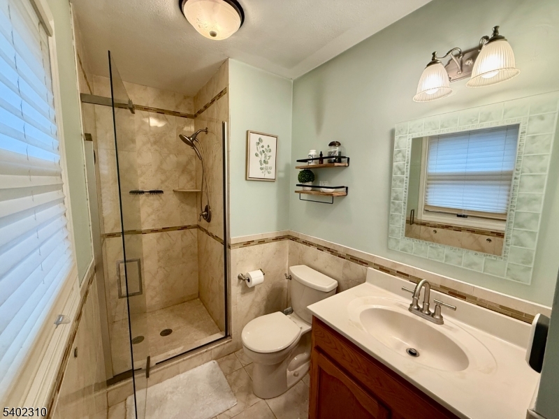 117 Papscoe Road West Milford, NJ 07421 - Photo 16 of 29 a bathroom with a sink toilet and shower