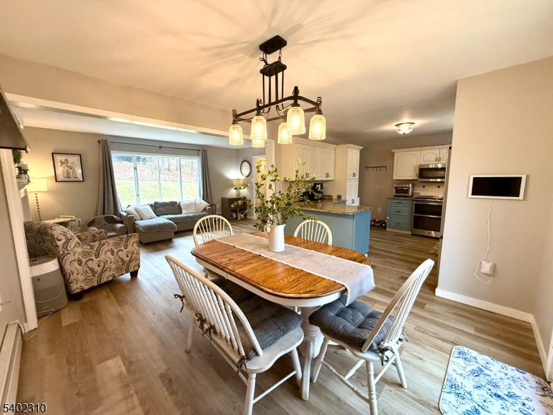 117 Papscoe Road West Milford, NJ 07421 - Photo 6 of 29 a dining room with furniture and wooden floor