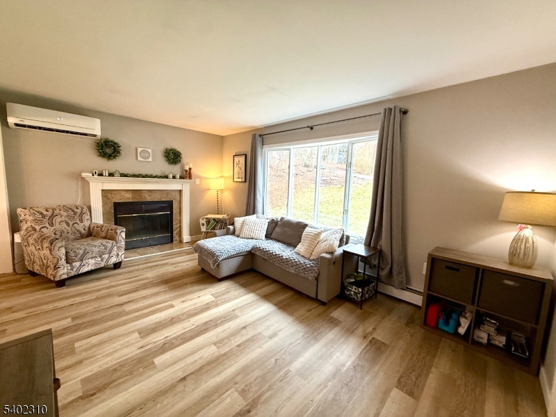 117 Papscoe Road West Milford, NJ 07421 - Photo 8 of 29 a living room with furniture and a fireplace