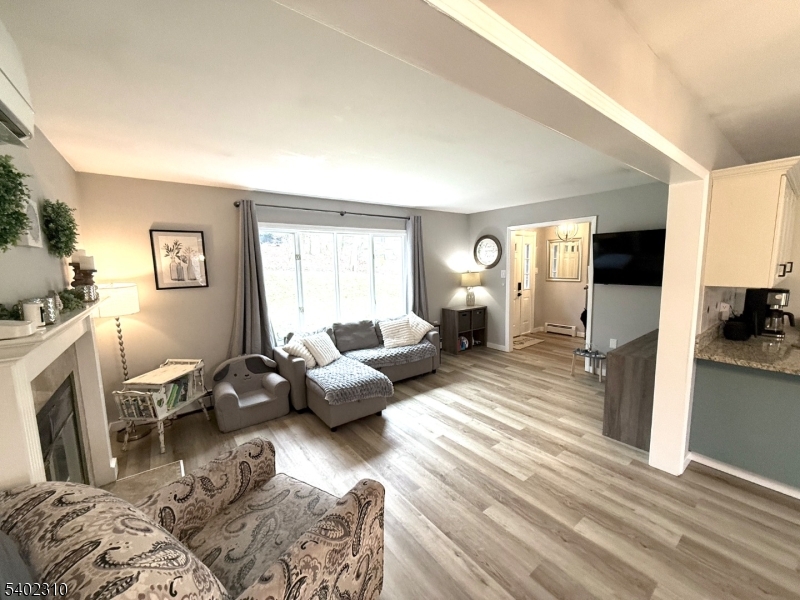 117 Papscoe Road West Milford, NJ 07421 - Photo 9 of 29 a living room with furniture and a flat screen tv