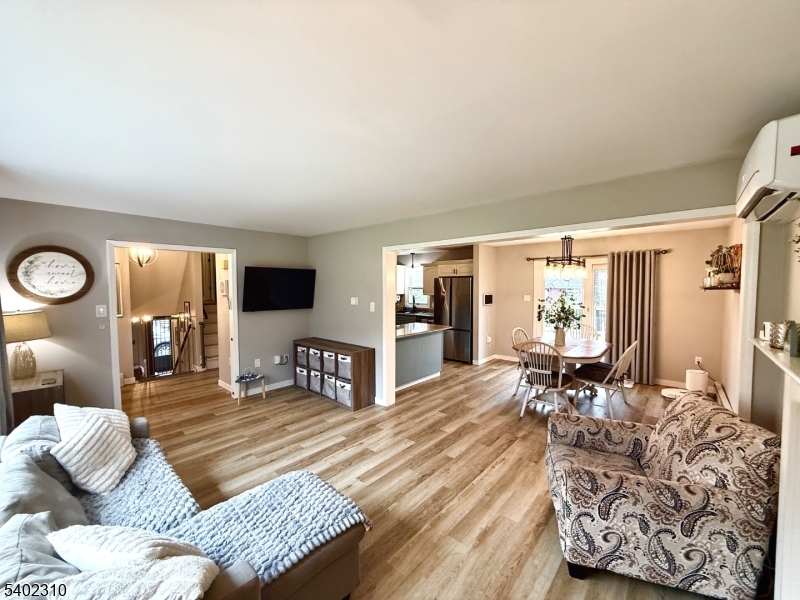 117 Papscoe Road West Milford, NJ 07421 - Photo 10 of 29 a living room with furniture and wooden floor