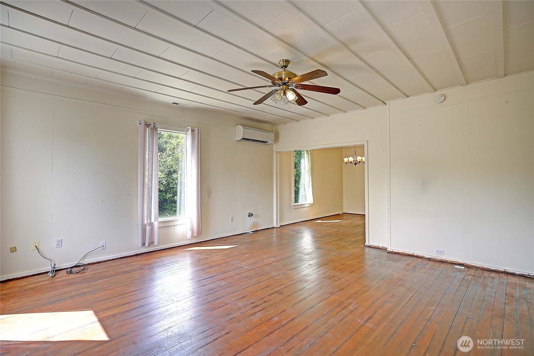 522 Chapman Road Camano Island, WA 98282 - Photo 11 of 26 a view of empty room with wooden floor and fan