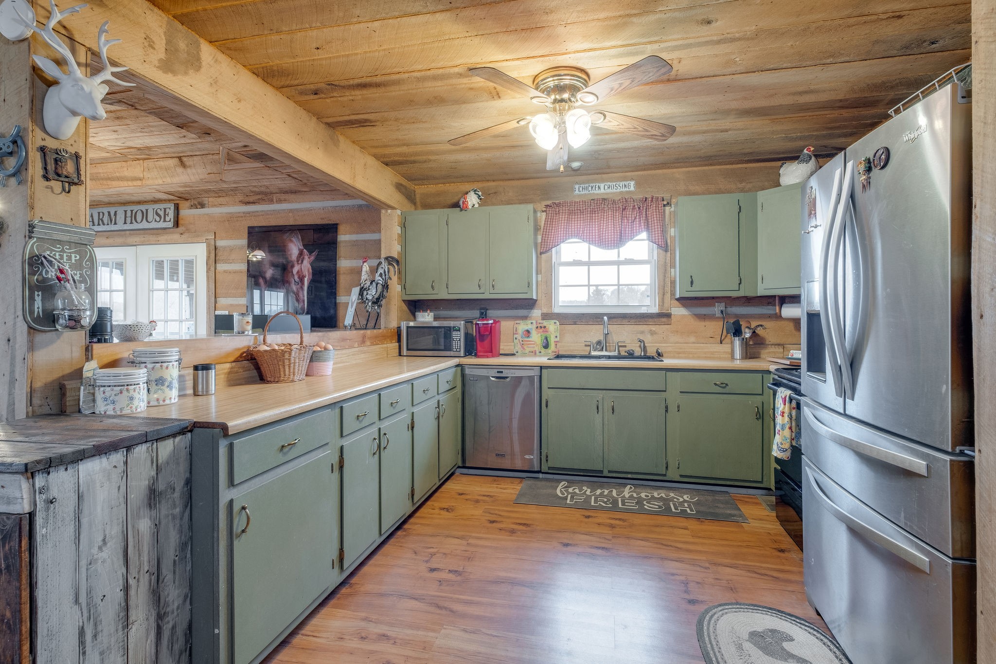 3854 Martins Chapel Road Springfield, TN 37172 - Photo 6 of 35 a kitchen with sink cabinets and wooden floor
