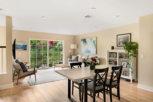 a view of a dining room with furniture window and outside view