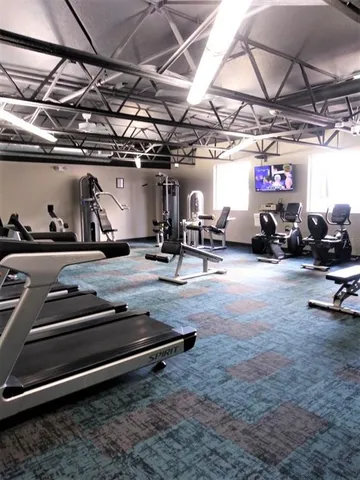 a view of room with gym equipment