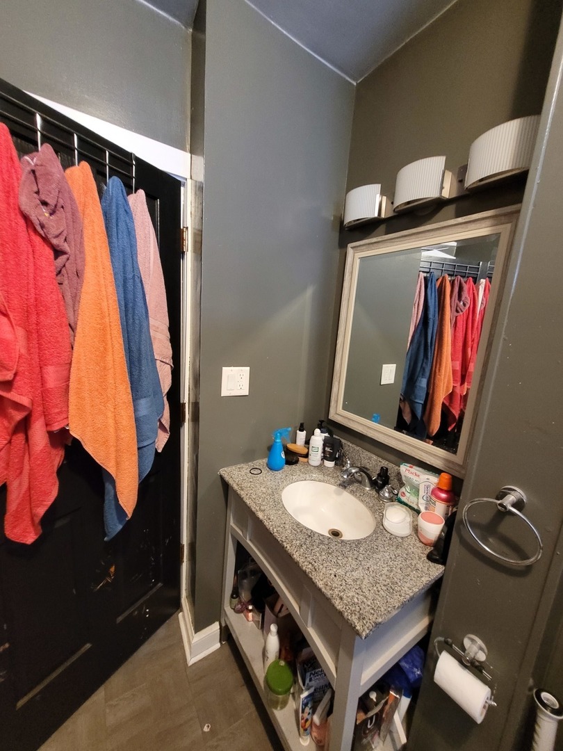14521 Avers Avenue Midlothian, IL 60445 - Photo 12 of 13 a bathroom with a sink and a mirror