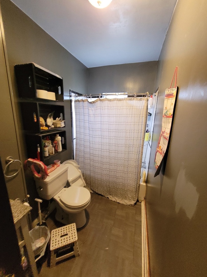 14521 Avers Avenue Midlothian, IL 60445 - Photo 13 of 13 a bathroom with a sink toilet and shower