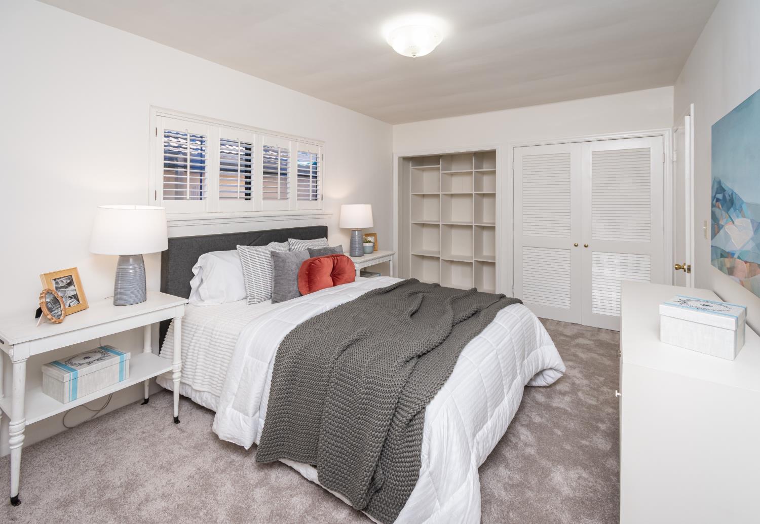 151 Coloma Way Sacramento, CA 95819 - Photo 19 of 28 a bedroom with a bed and a cabinets