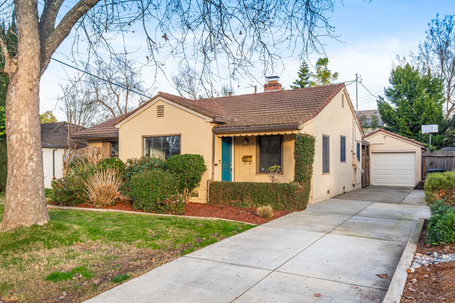 151 Coloma Way Sacramento, CA 95819 - Photo 2 of 28 a front view of a house with a garden and plants