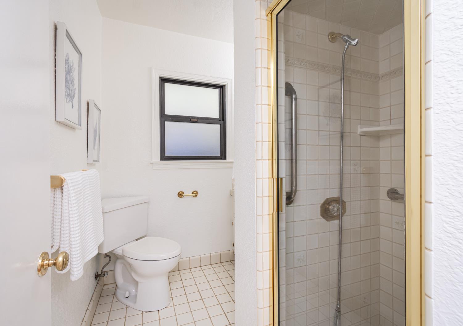 151 Coloma Way Sacramento, CA 95819 - Photo 22 of 28 a bathroom with a toilet a sink and shower