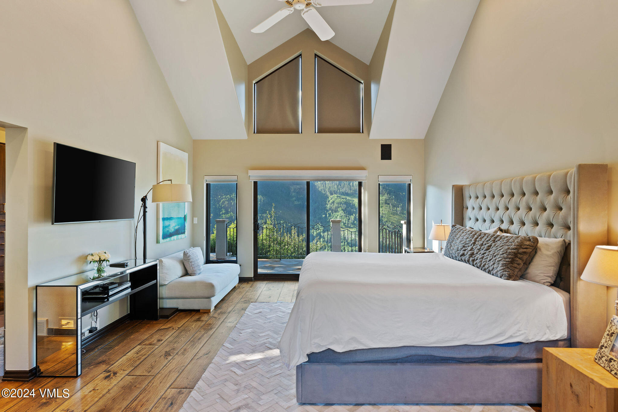 1675 Aspen Ridge Road Vail, CO 81657 - Photo 18 of 53 a spacious bedroom with a bed and a flat screen tv