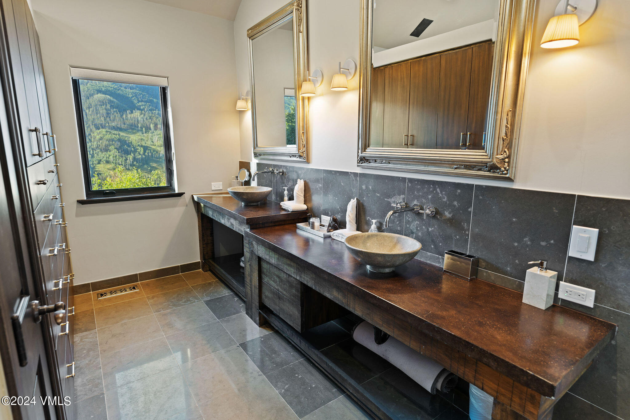 1675 Aspen Ridge Road Vail, CO 81657 - Photo 21 of 53 a bathroom with a granite countertop sink a mirror and shower