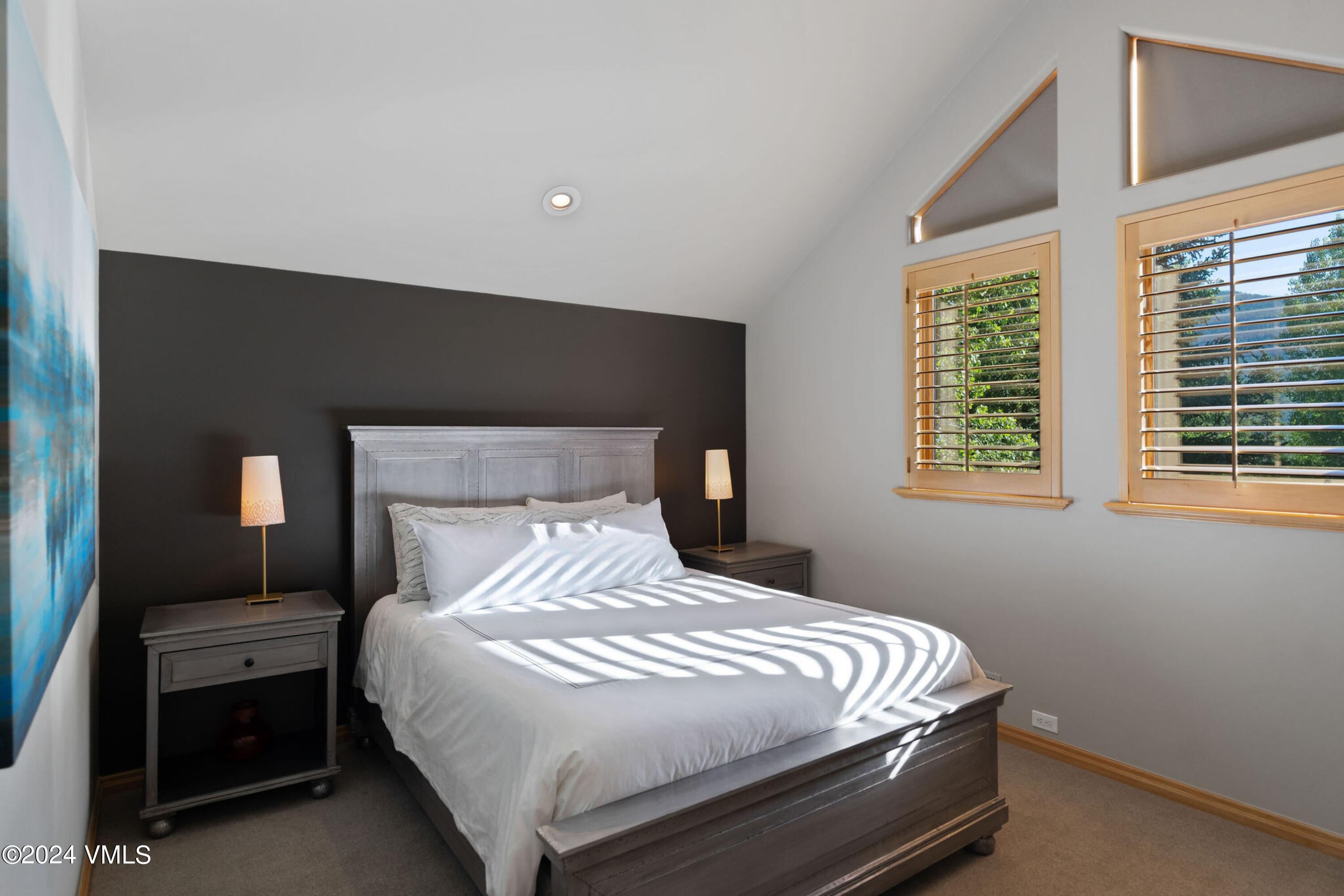 1675 Aspen Ridge Road Vail, CO 81657 - Photo 30 of 53 a bedroom with a bed and a window