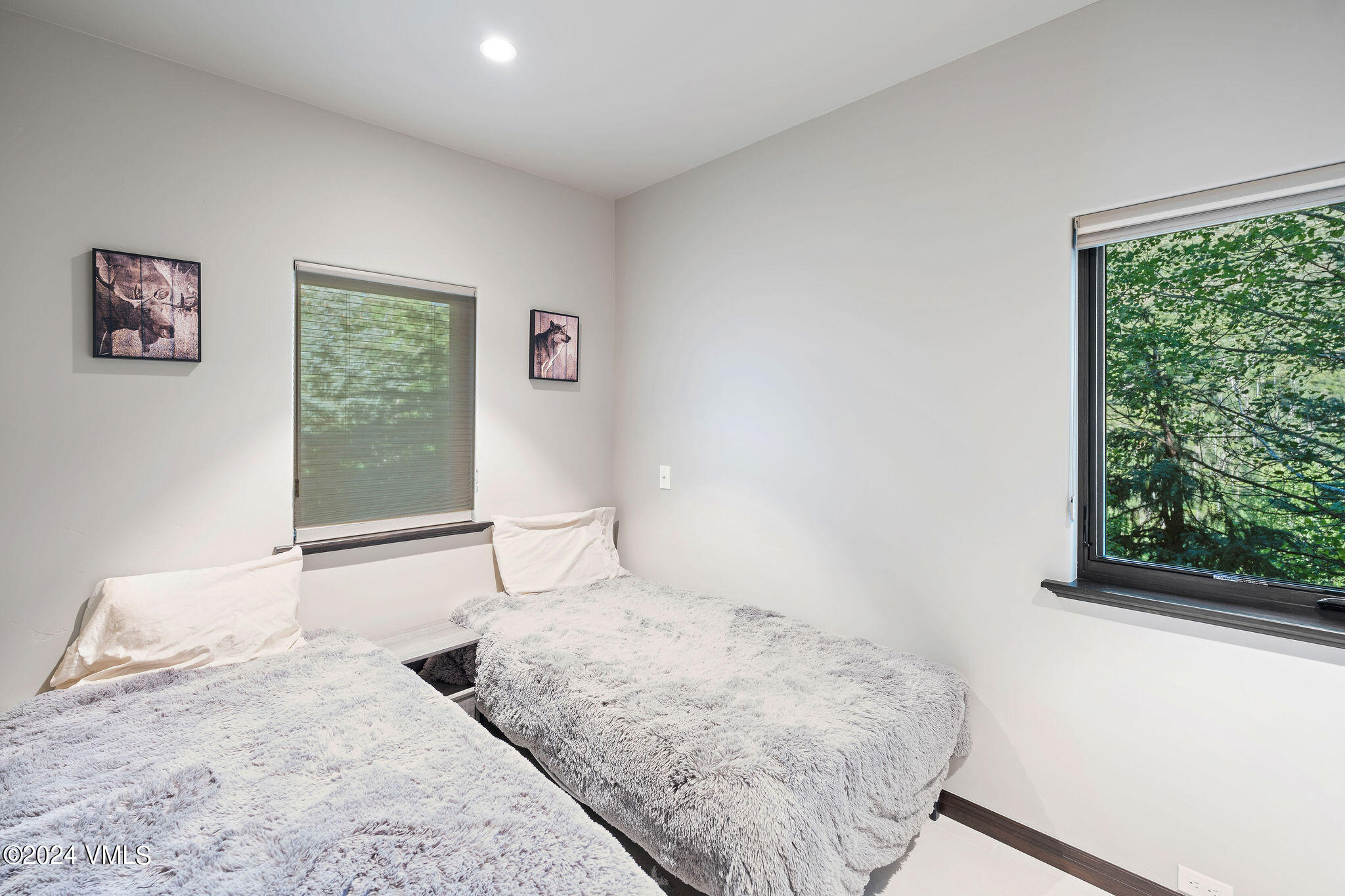 1675 Aspen Ridge Road Vail, CO 81657 - Photo 34 of 53 a bedroom with a bed and a window