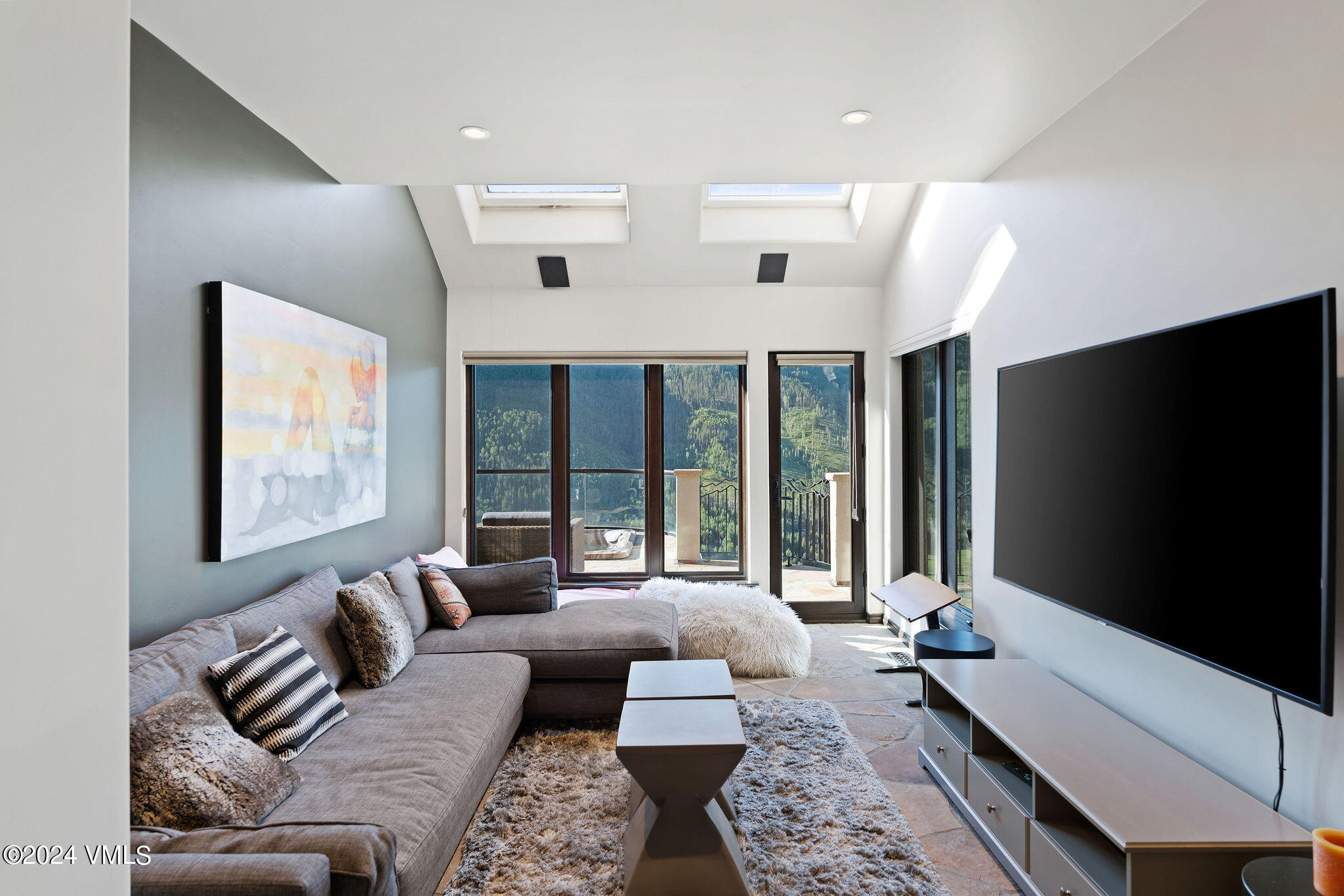 1675 Aspen Ridge Road Vail, CO 81657 - Photo 39 of 53 a living room with furniture and large windows
