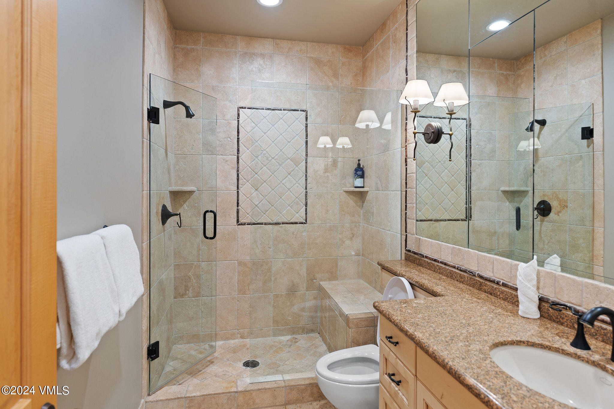 1675 Aspen Ridge Road Vail, CO 81657 - Photo 41 of 53 a bathroom with a granite countertop sink a toilet and shower