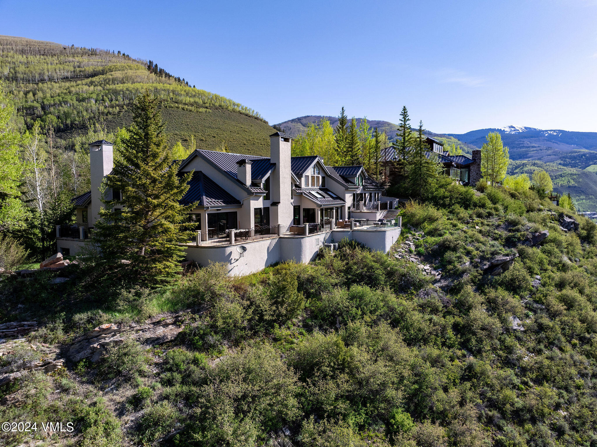1675 Aspen Ridge Road Vail, CO 81657 - Photo 50 of 53 an aerial view of a house with garden space and a street view