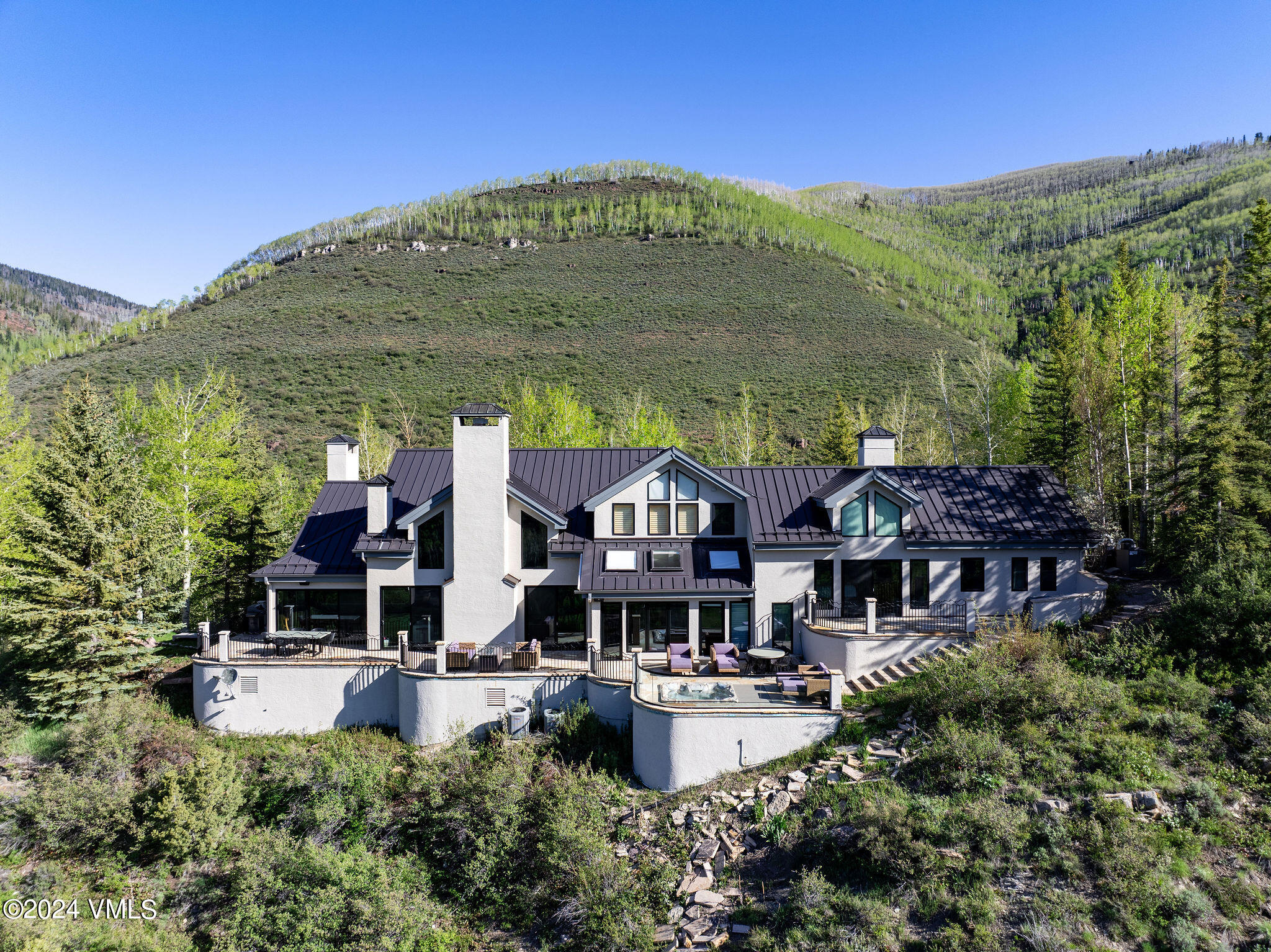 1675 Aspen Ridge Road Vail, CO 81657 - Photo 51 of 53 a front view of a house with swimming pool and outdoor seating