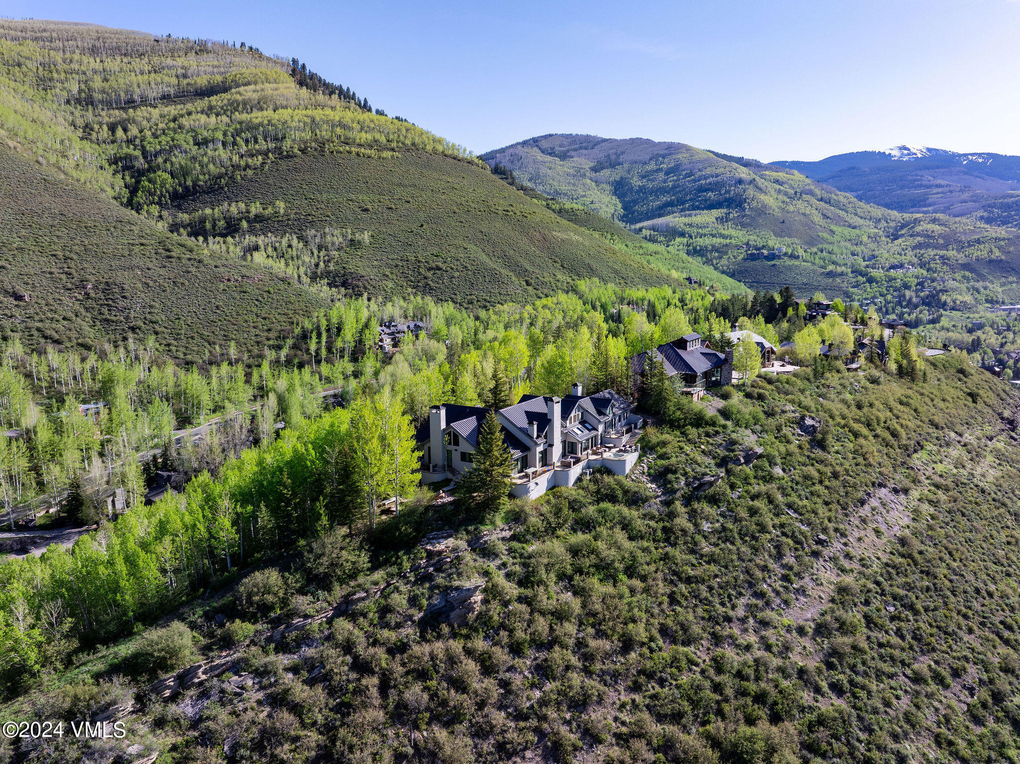 1675 Aspen Ridge Road Vail, CO 81657 - Photo 52 of 53 a view of a lush green hillside and houses