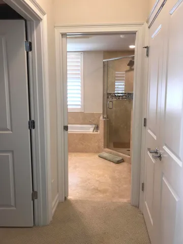 a bedroom with a bed dresser and a window