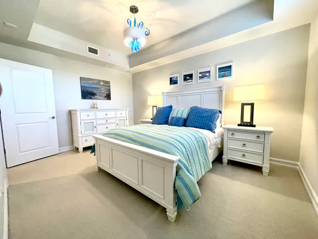 a view of walk in closet with clothes