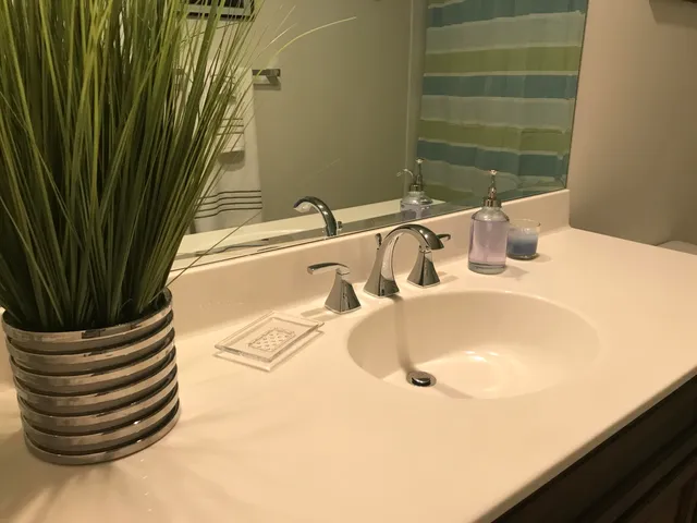 a painting on the wall next to a white wall