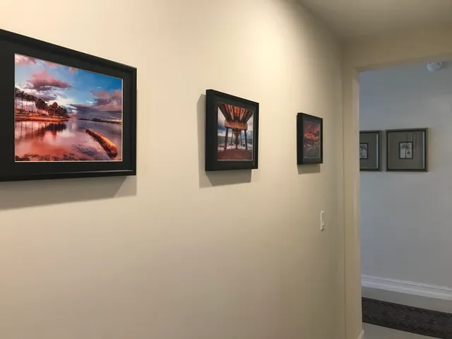 a view of a dining room with furniture and a large window